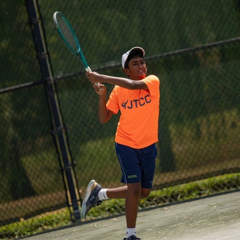 Junior Tennis Player hitting backhand in college park Maryland