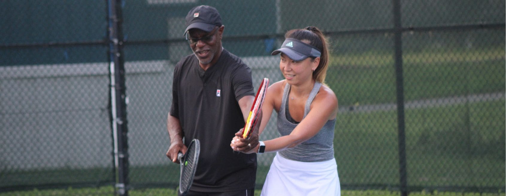Adults playing on the JTCC courts