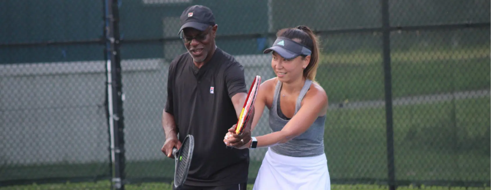Adults playing on the JTCC courts
